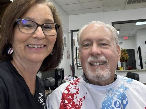 466891985_1162815089185055_9005688685890945975_n-cropped Smiling woman with glasses and a man at JD Barber Shop for professional men's haircut and grooming.