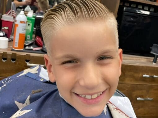 7512fd128983da7407b7acbb73fc6751-800x554 Young boy with a fresh, stylish haircut at JD Barber Shop, professional men's grooming service.