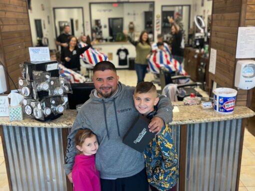 JD Barber Shop Magnolia TX Photo Gallery Happy family at JD Barber Shop, kids receiving stylish haircuts, friendly barbers.