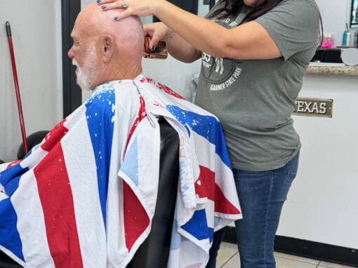 JD Barber Shop Magnolia TX Photo Gallery Bald man getting a haircut at JD Barber Shop, professional grooming service in Texas.