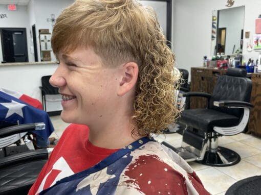JD Barber Shop Magnolia TX Photo Gallery Curly mullet haircut at JD Barber Shop, modern men's grooming salon in Texas.